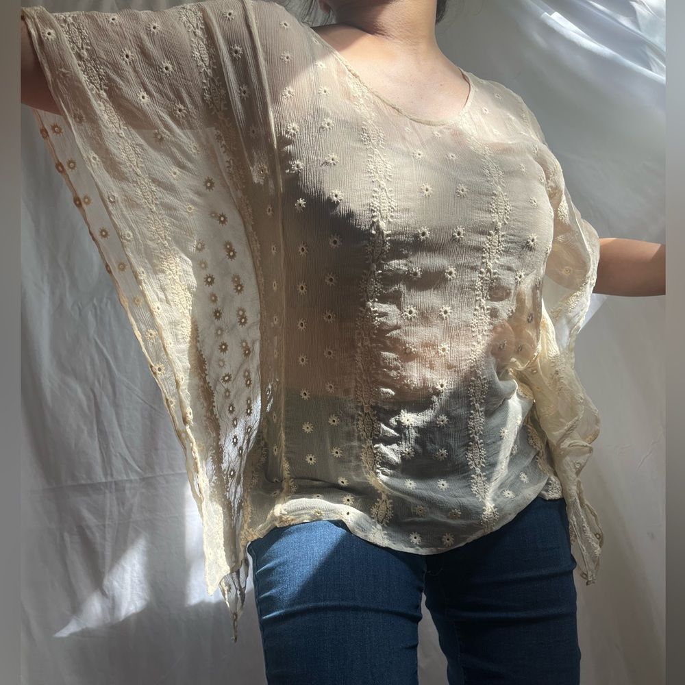 Medium/large 100% silk sheer cream eyelet top with batwing sleeves.